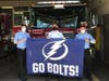 Tampa Fire Rescue firefighters display their Bolts team pride. ​