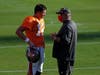 Quarterback Tom Brady and Head Coach Bruce Arians talk during last week's training camp. 