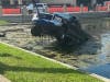 The driver of a pickup truck escaped injury Wednesday afternoon after crashing into a retention pond outside the Pinellas County Courthouse.