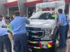 Members of Palm Fire Rescue dry off the new vehicle, symbolizing their commitment to take care of it. 