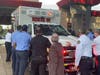 In an age-old tradition, members of the Palm Fire Rescue push the new rescue vehicle into its bay.