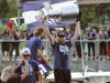 Lightning Capt. Steve Stamkos holds up the Stanley Cup during a boat parade on the Hillsborough River. 
