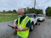 Kevin Hilpl from the Pinellas County Building Department evaluates a flooded area. 