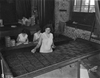 Workers roll cigars during the factory's heyday.