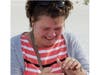 Imke Borawski cries as ring finder Bill Gallant hands her back her husband's lost wedding ring. 