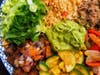 The Xochitl Bowl Rice includes a choice of heirloom refried beans, choice of protein, guacamole, summer squash, topped with queso fresco, and side of pico de gallo. Add chicken or carne asada or enjoy the vegan option. 