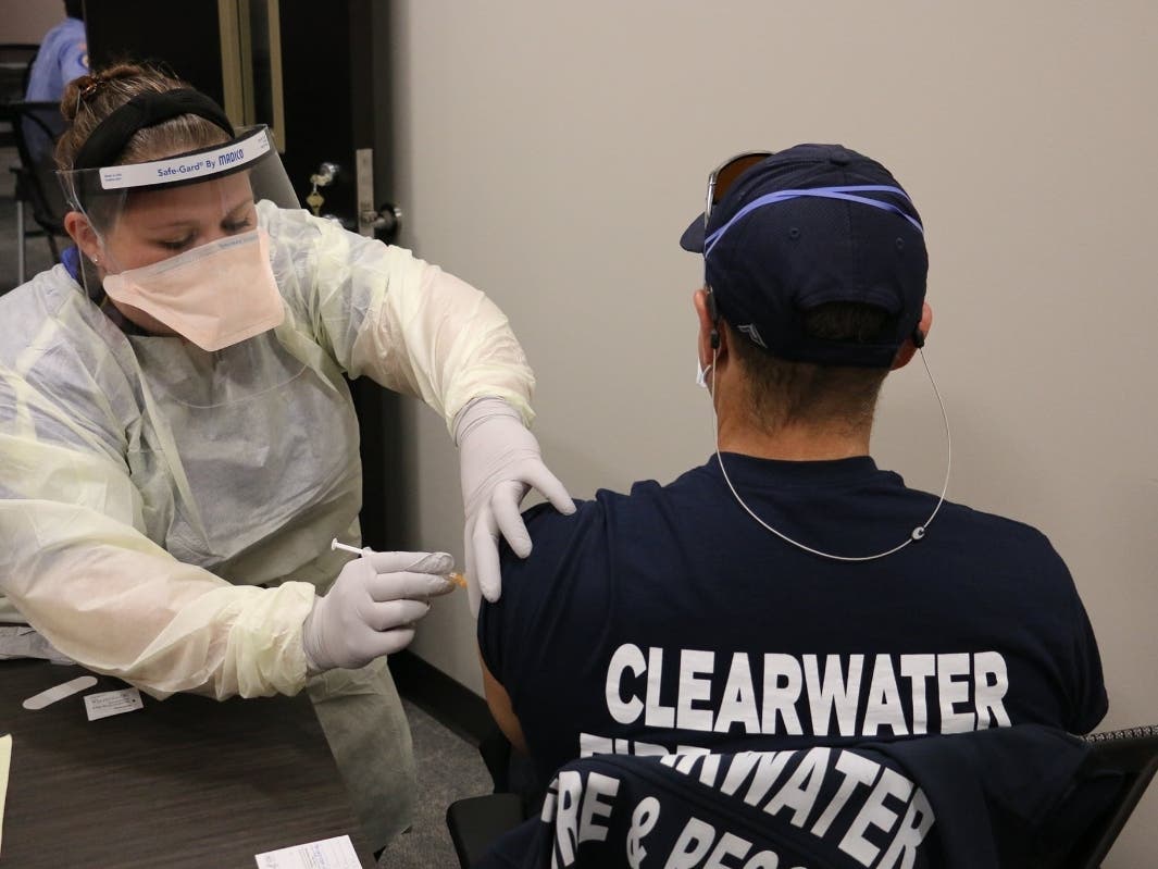 A member of Clearwater Fire & Rescue receives the vaccine. 