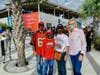 Tampa Mayor Jane Castor poses with Bucs fans at the NFL Experience.