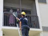 Firefighters deliver a dozen red roses to Betty Helmuth on her second-floor balcony at Grand Villa of Clearwater on her 97th birthday.