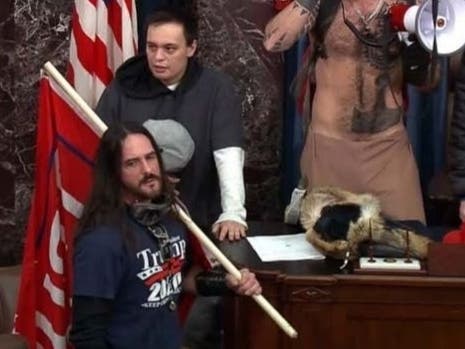 Paul Allard Hodgkins of Tampa is seen in photographs in the Senate chamber holding a flag bearing the words "Trump 2020," the FBI said.