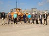 City officials, the architect and the contractor participate in a groundbreaking ceremony. 