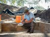 University of South Florida archaeology professor Jeff Moates records findings at the excavation site.