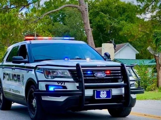 Tampa police released a body camera video Wednesday that shows a resource officer at Middleton High School using racial slurs while talking on the phone.