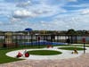 Kiddie Academy of Wiregrass Ranch has an outdoor play area, soccer field and splash pad. 