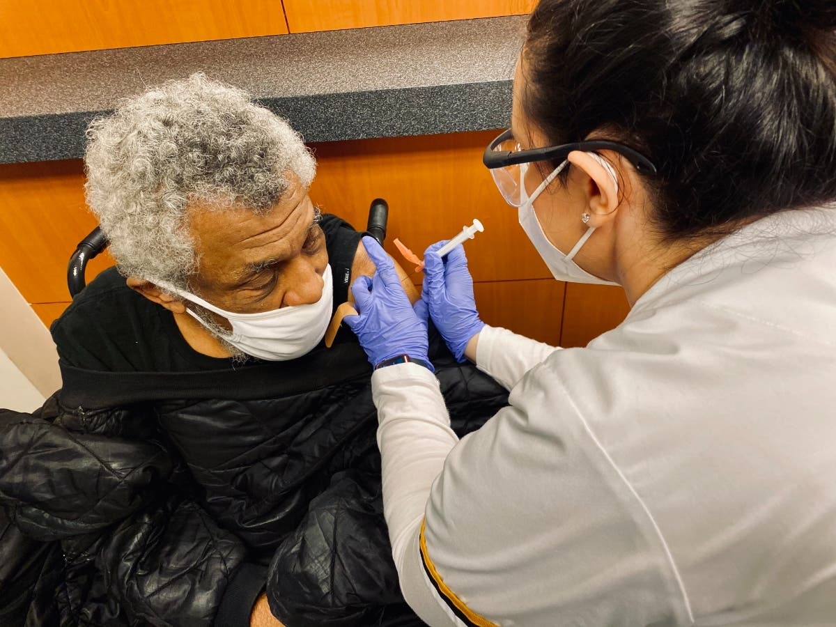 Pasco County resident Freeman Health gets a vaccination through AdventHealth during a clinic organized by his church. 