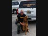 The 5-year-old bloodhound poses with his handler, Deputy Chris Miller. 