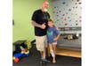 Steve Chamberland poses with one of the children he's helped at Prosthetic and Orthotic Associates in Orlando. 