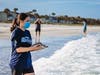 A member of the rescue team prepares to release Ludwig at Morgan Beach Park. 
