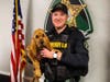 Deputy Bobby Lewis holds K-9 Hemi.