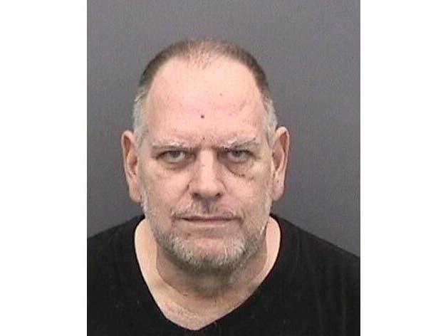 Ric Adams has been charged with 100 counts of possessing child pornography.
