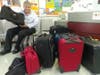 Greg Giordano displays luggage donated by members of the community.