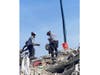 Tampa Bay search-and-rescue workers comb through the rubble of Champlain Towers South Condo.