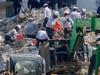 Tampa Bay search-and-rescue workers comb through the rubble of Champlain Towers South Condo.