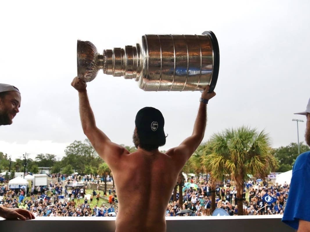 Lightning star center Nikita Kurcherov displays the Stanley Cup to a cheering crowd in Tampa. 