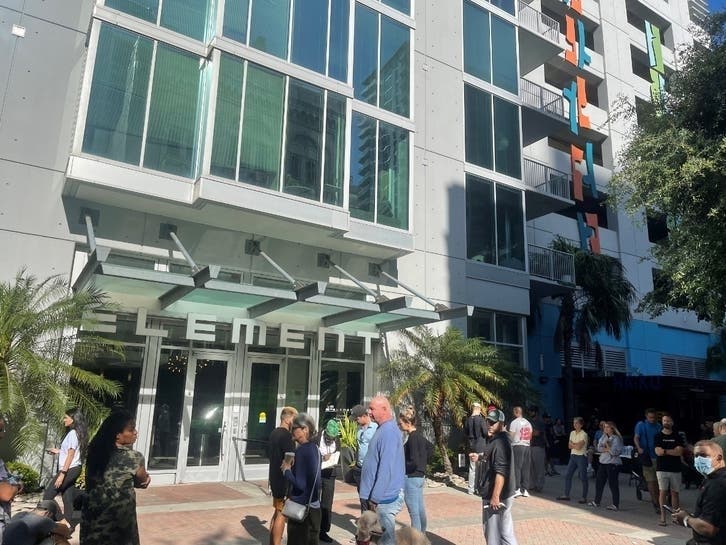 Residents stand outside the Element following its evacuation July 16. 