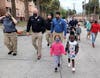 Tampa Police Chief Brian Dugan and Assistant Police Chief Ruben Delgado march with members of Rise Up for Peace in Tampa.  