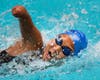 Momo Sutton, 14, competes in swimming.