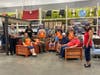 Team Depot at the New Port Richey Home Depot relax following a day of building outdoor furniture. 