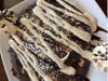 ​Rocky Road Pancakes are made with rich chocolate pancake batter filled with chocolate chips and slivered almonds, then topped with marshmallow sauce.