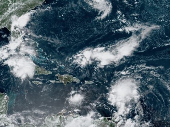 NOAA satellite images on Saturday show Tropical Storm Grace following behind Fred in the Atlantic. 