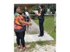 Suni Bell's grandmother, Drial Bell, joins police in canvassing the neighborhood, seeking tips on her granddaughter's killer. 