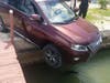Police were notified that a car was precariously perched with the back end on the pavement and the front end hanging over the water. 