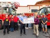Winn-Dixie associates present Tampa firefighters with a check for $2,001. 
