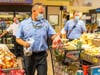 Tampa firefighters stock up on groceries Saturday with the 20 percent discount from Winn-Dixie.