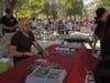 An artist signs some autographs at the Conga Caliente Festival. 