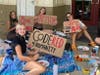 Members of Sunrise Plant High School create signs for the "code red" rally. From left are Giani Cruickshank, Zoey Almquist-Hardin, Ava Voronec and Katey Coursen