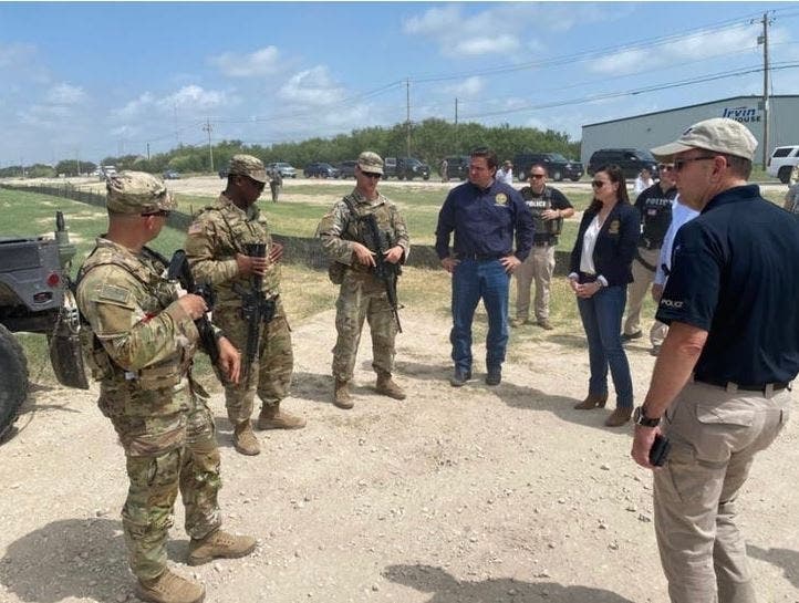 Florida Gov. Ron DeSantis and Attorney General Ashley Moody talk with border patrol members on the Mexico-Texas border. 