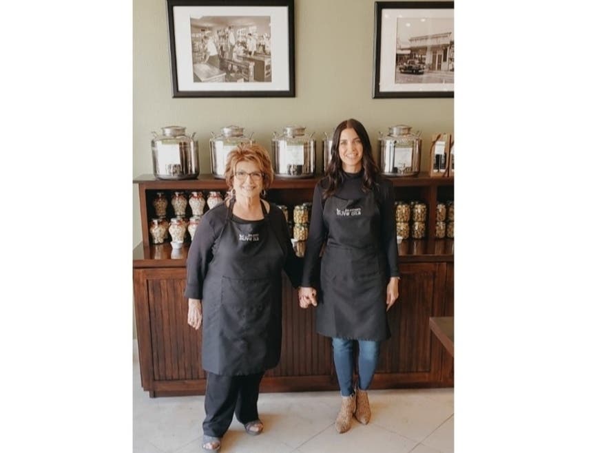 Joe and Son’s Olive Oils owner Andrea Messina poses with her mother, Marilyn Messina, known as Mama Olive.