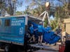 ZooTampa team members use a pulley system to lift the 1,000-pound manatee out of the truck.