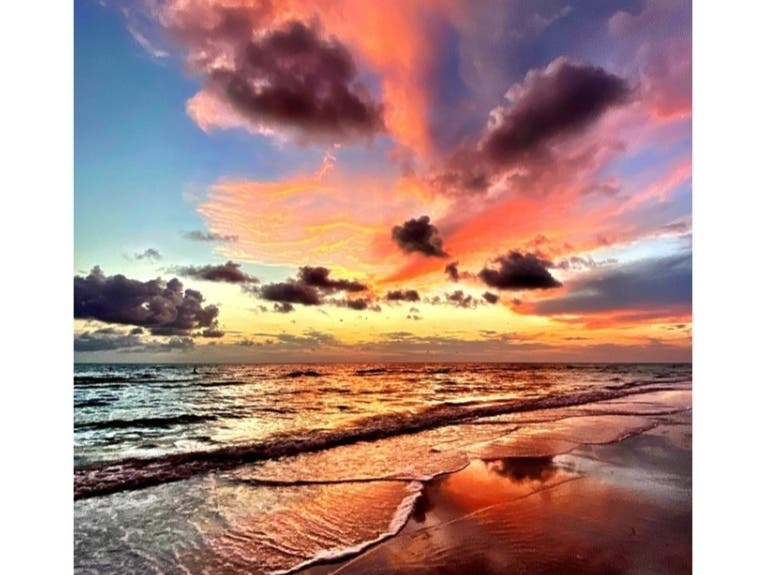 ​Paul Csogi of Bradenton captured the reflection of clouds in varied hues reflected in the gulf. 