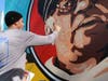"'Measured' strives to convey the message that success is not defined by winning, but how life’s unexpected paths bloom when one never gives up," said muralist Jay Giroux.