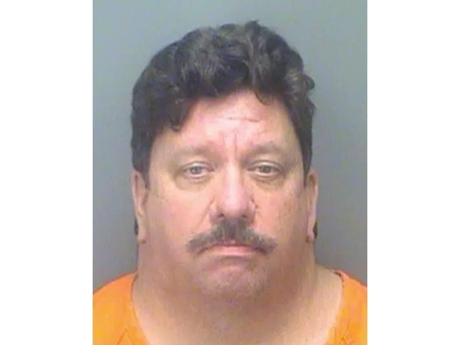 Christopher Ferguson was charged with one count of extortion and discharged from his job at the clinic.