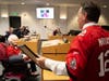 Alice Proctor, showing her new allegiance to the Tampa Bay Bucs by wearing a Bucs jersey, is recognized by the Pasco commission on her 100th birthday. 