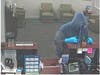 Before making off with an undisclosed amount of money, he told the clerk he was sorry, adding, "God bless," then he fled.