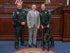 Cpl. Eric Demas, Sgt. Christina Demas and K-9 Dobies poses with Florida House Speaker Chris Sprowls. 