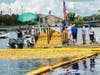 Duck race organizers prepare to release the rubber ducks into the Hillsborough River.